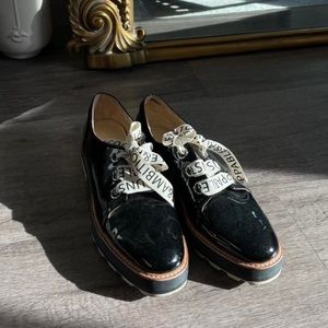Platform Loafers with designed laces and white bottoms